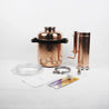 photo of the parts of a copper moonshine still
