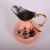 Copper pitcher with brass handle